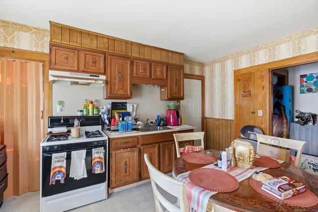 a room with furniture a rug and a window