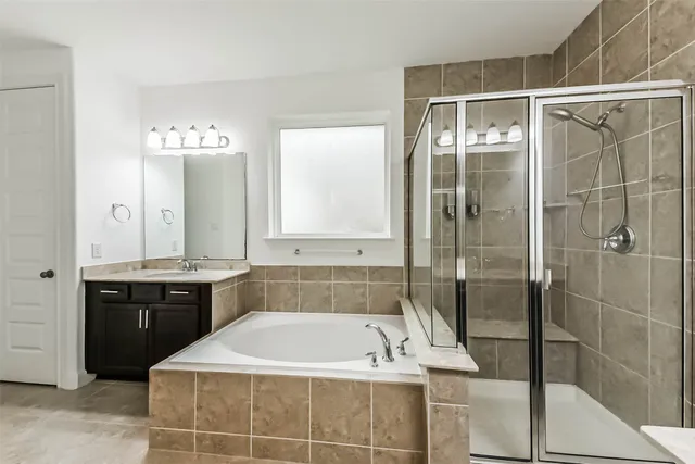 a bathroom with a bathtub and a sink