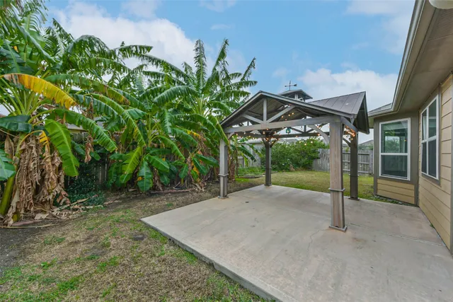 an aerial view of a house with a garden