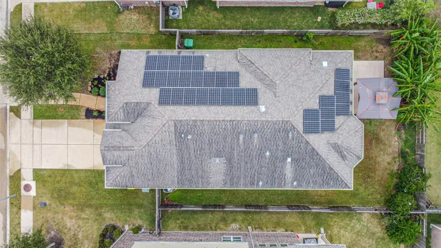 an aerial view of a house with a lake view