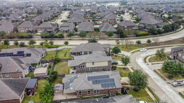 an aerial view of multiple houses with outdoor space