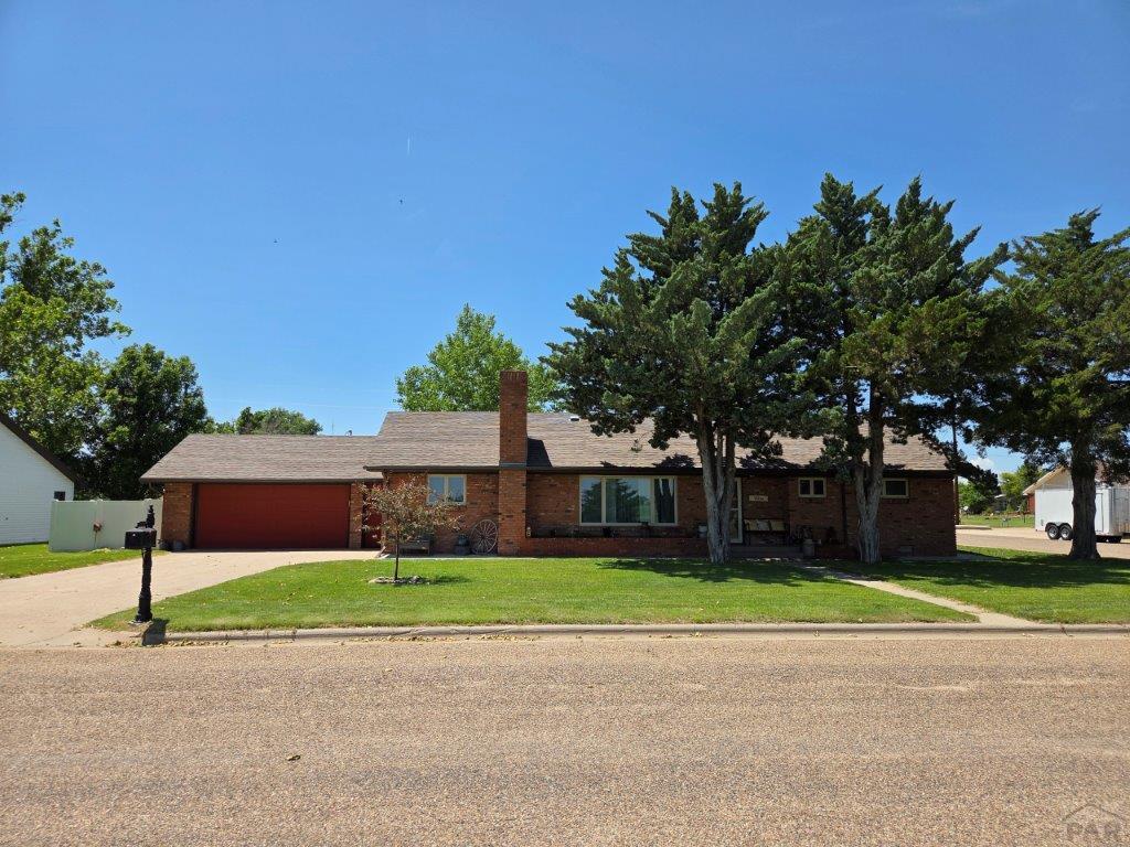 1000 Rittgers Street Eads, CO 81036 - Photo 1 of 33 a house with a tree in front of it