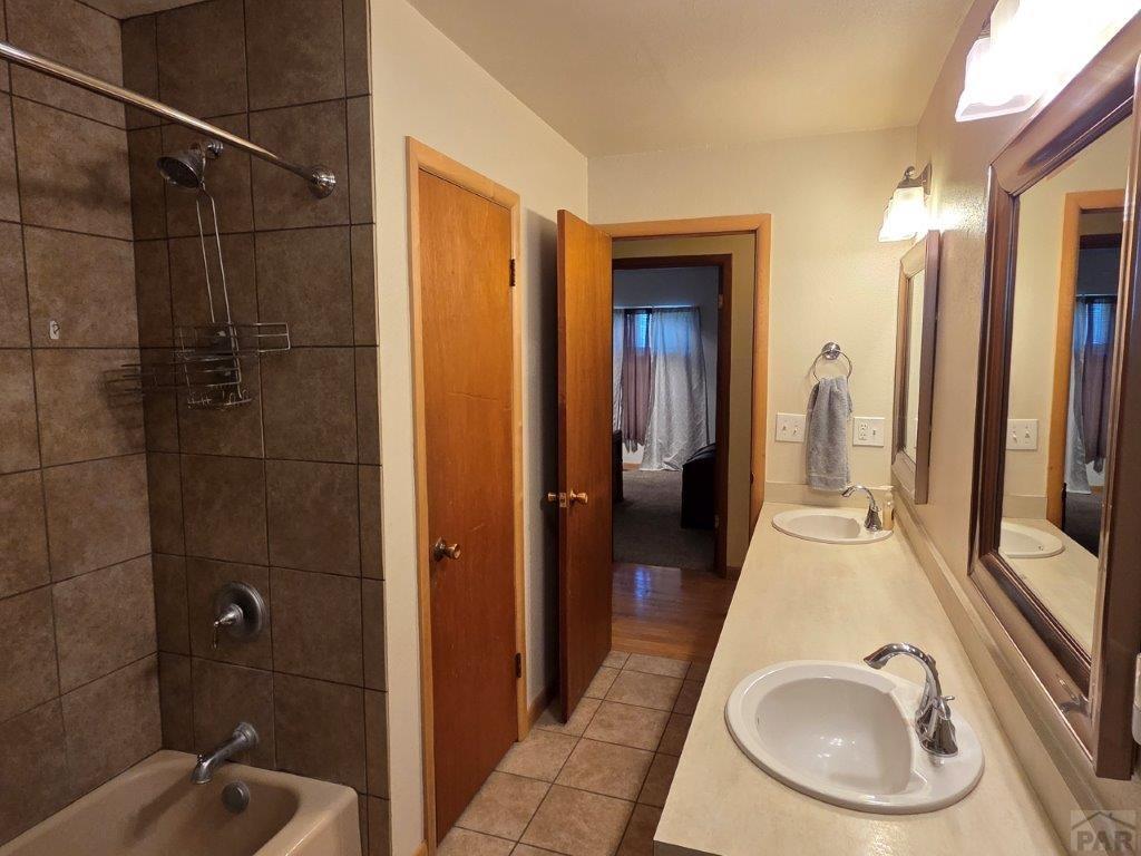 1000 Rittgers Street Eads, CO 81036 - Photo 16 of 33 a bathroom with a sink a mirror and shower