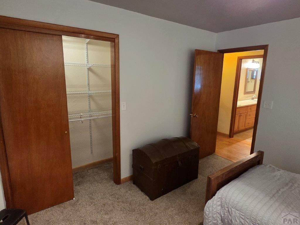 1000 Rittgers Street Eads, CO 81036 - Photo 19 of 33 a bedroom with a bed and a window