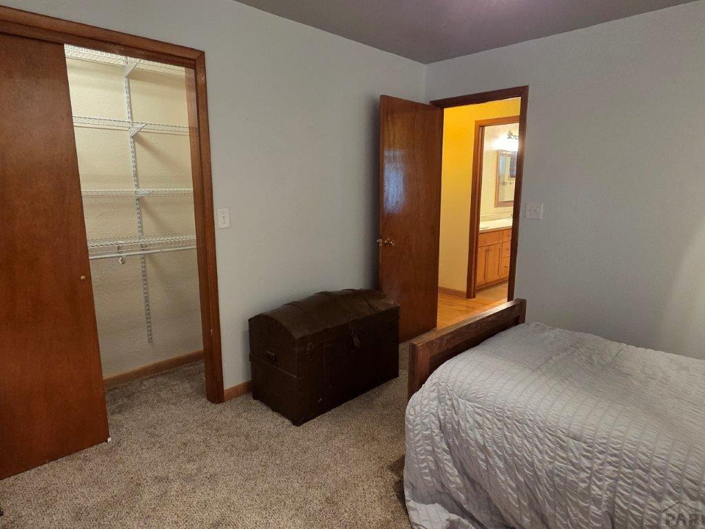 1000 Rittgers Street Eads, CO 81036 - Photo 20 of 33 a bedroom with a bed and a window