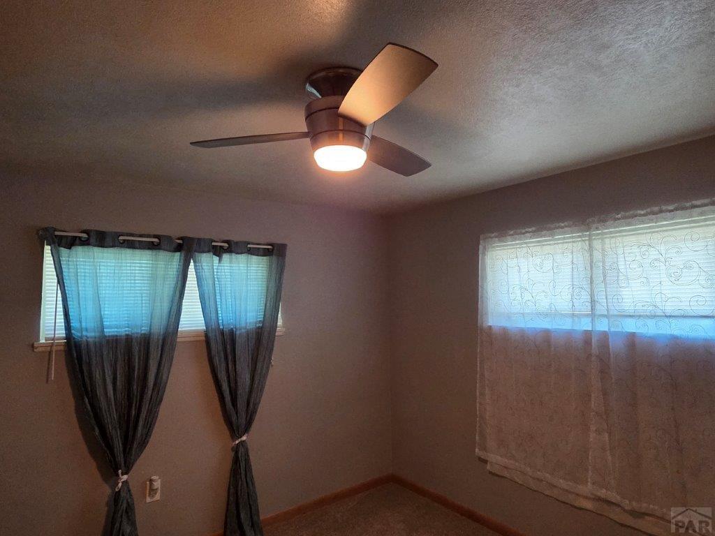 1000 Rittgers Street Eads, CO 81036 - Photo 21 of 33 wooden floor in an empty room with a window