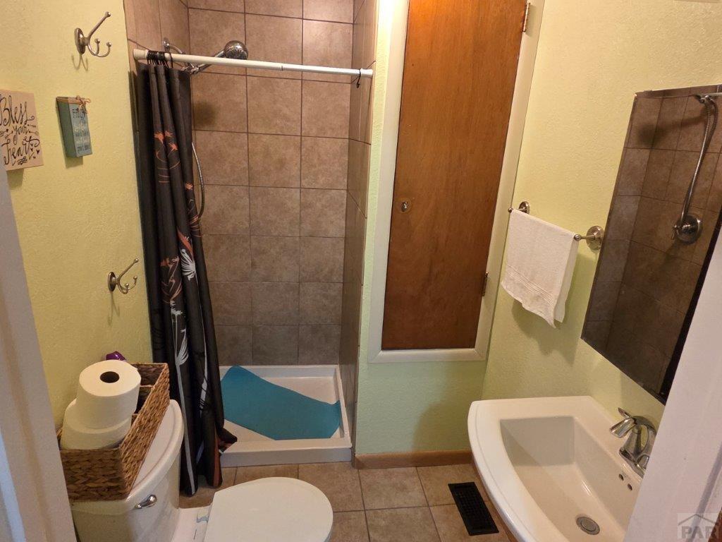 1000 Rittgers Street Eads, CO 81036 - Photo 25 of 33 a bathroom with a toilet and a shower