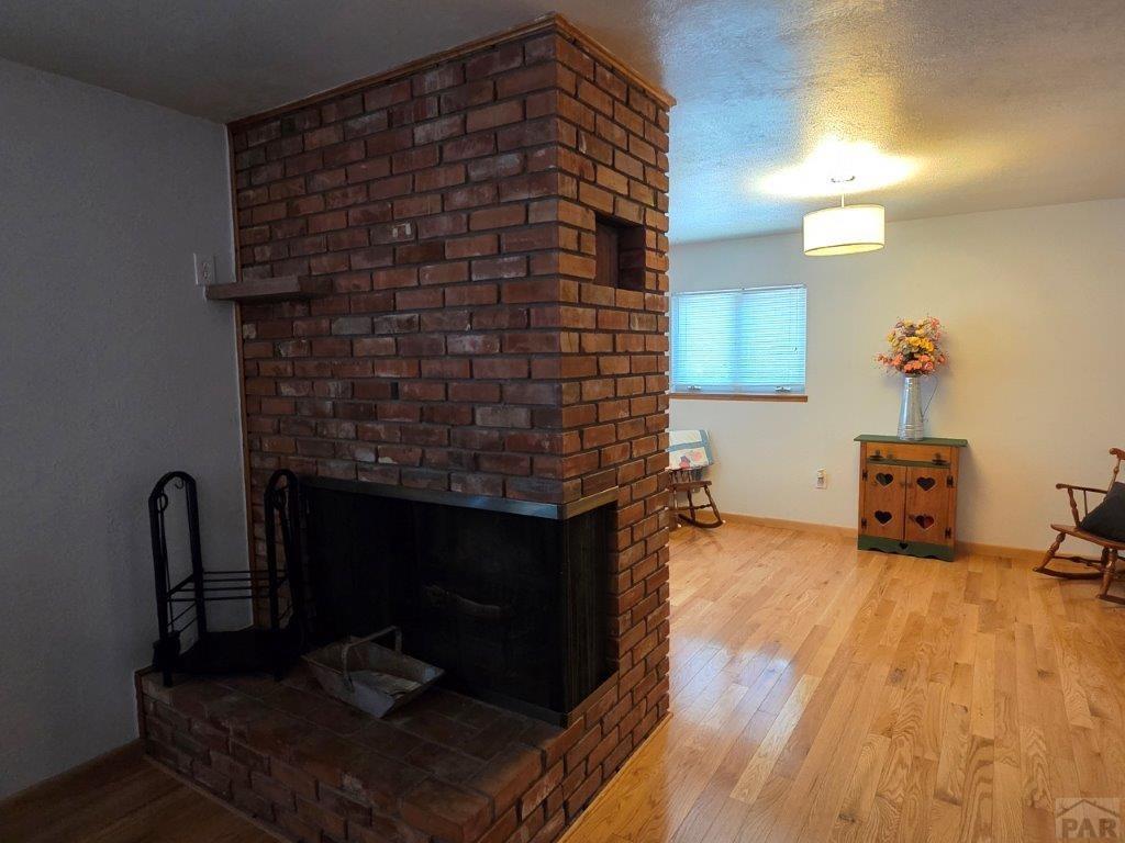 1000 Rittgers Street Eads, CO 81036 - Photo 4 of 33 a living room with furniture and a fireplace
