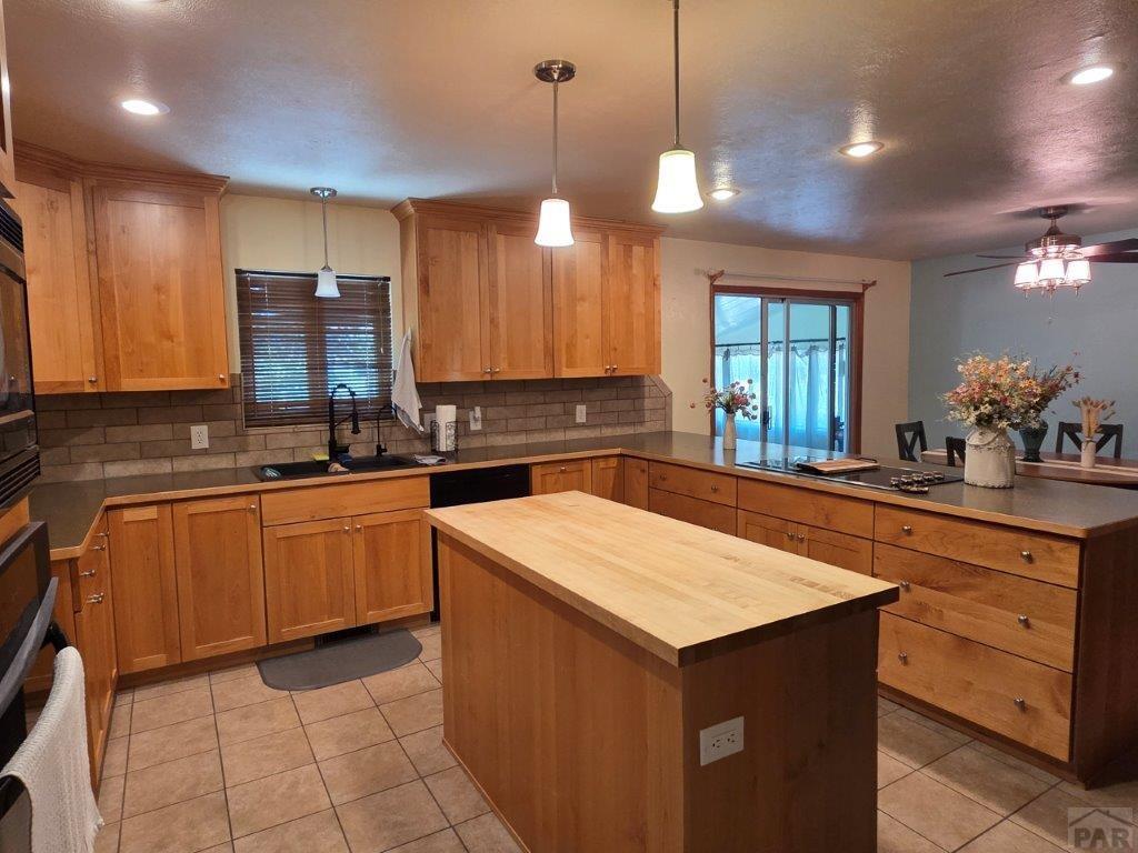 1000 Rittgers Street Eads, CO 81036 - Photo 7 of 33 a kitchen with stainless steel appliances a sink stove and cabinets