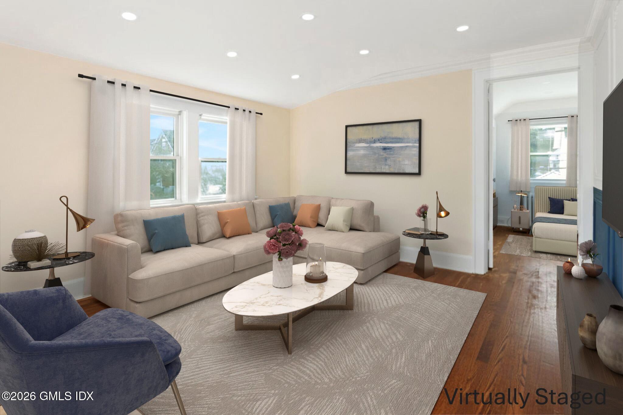 71 Prospect Street, Unit 2 Greenwich, CT 06830 - Photo 8 of 17 a living room with furniture and a large window