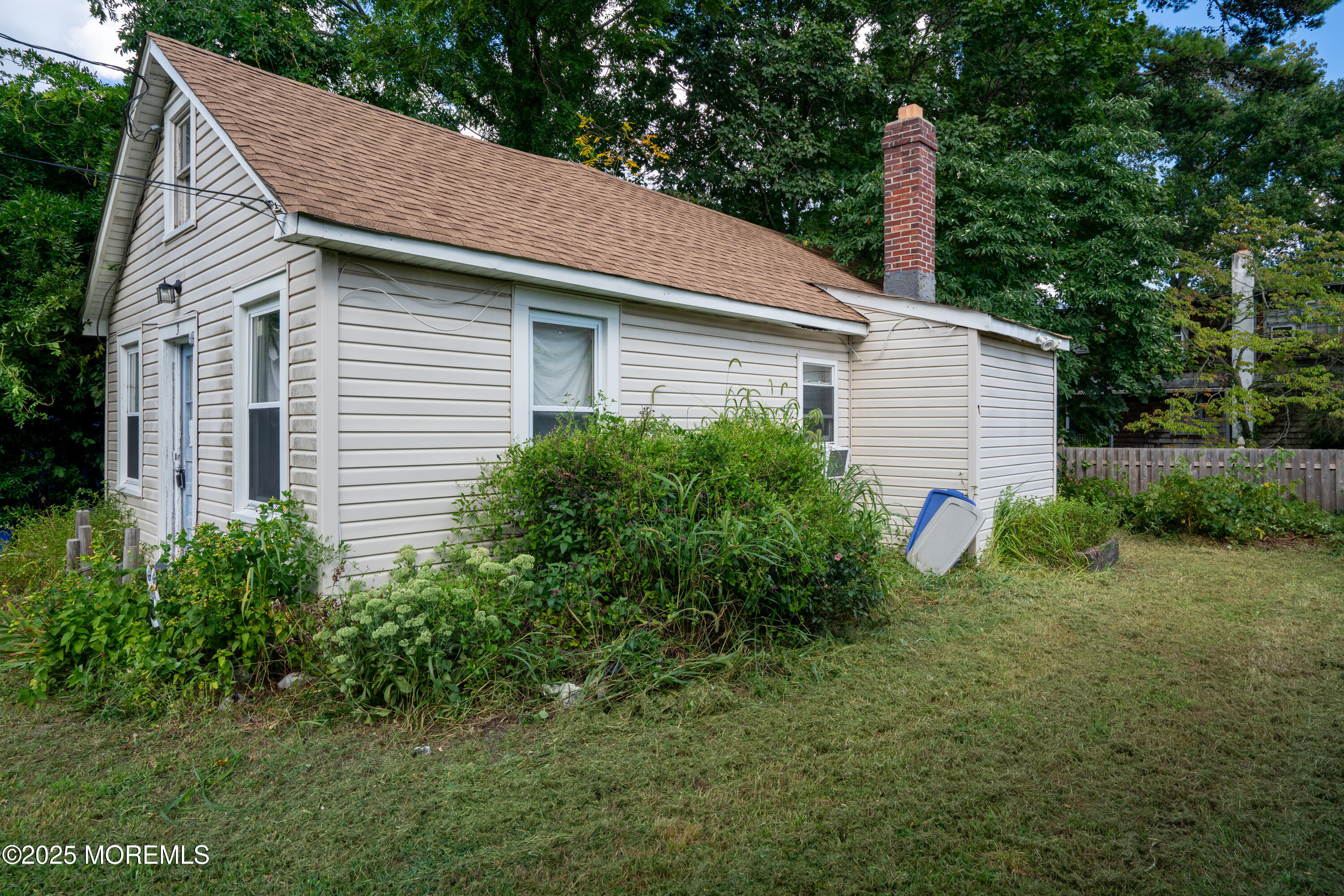 3 Highland Avenue Island Heights, NJ 08732 - Photo 11 of 19 a view of a house with a backyard and a tree