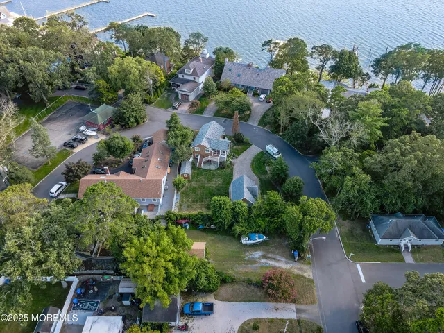 an aerial view of a house with yard