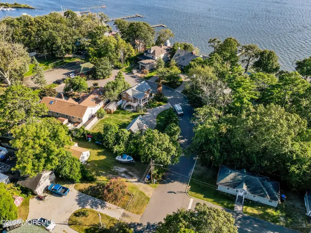 a backyard of a house with a yard and outdoor seating