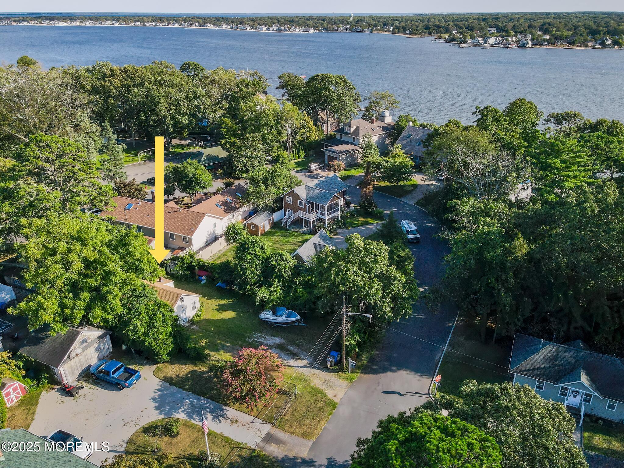 3 Highland Avenue Island Heights, NJ 08732 - Photo 2 of 19 a view of a lake with a building in the background