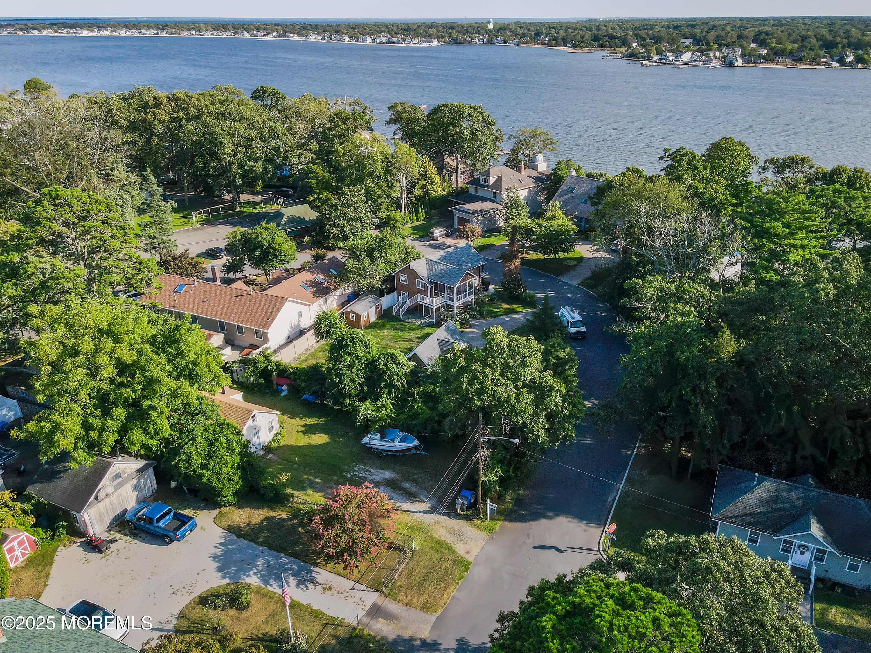 3 Highland Avenue Island Heights, NJ 08732 - Photo 3 of 19 an aerial view of a house with a garden and lake view