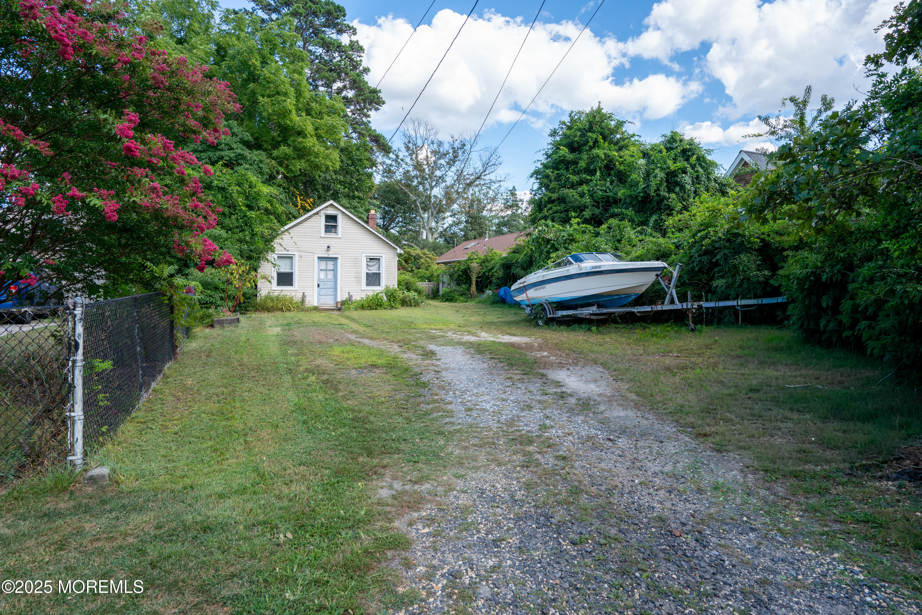 3 Highland Avenue Island Heights, NJ 08732 - Photo 4 of 19 a view of a house with a yard and large trees