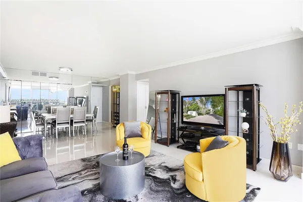 a living room with fireplace furniture and a flat screen tv
