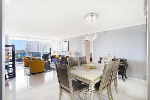 a view of livingroom and dining room with furniture