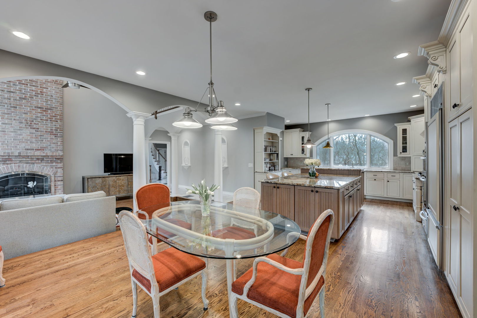 791 South Ridge Road Lake Forest, IL 60045 - Photo 11 of 40 a kitchen with stainless steel appliances a dining table chairs a sink and a refrigerator