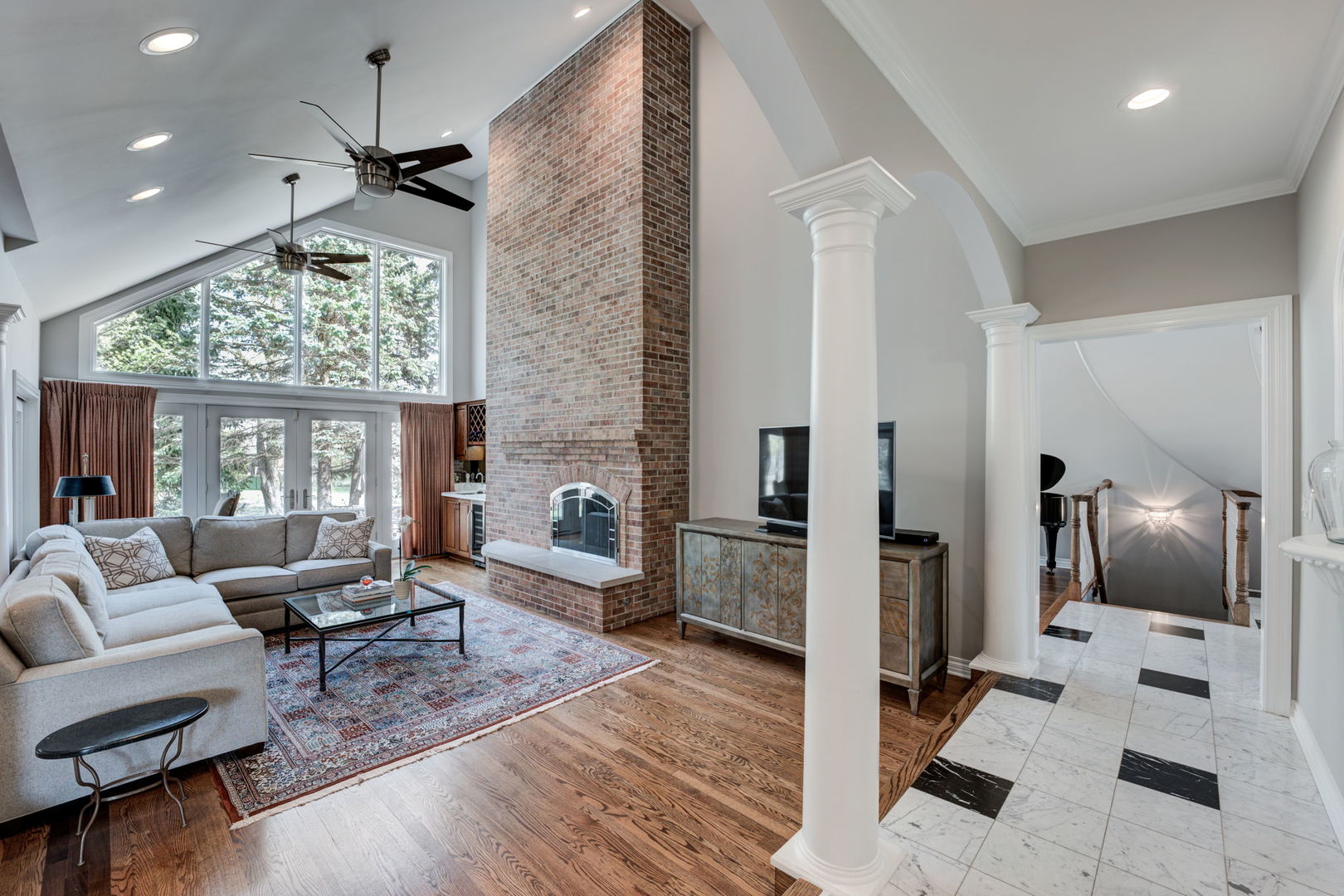 791 South Ridge Road Lake Forest, IL 60045 - Photo 13 of 40 a living room with furniture a fireplace and a flat screen tv