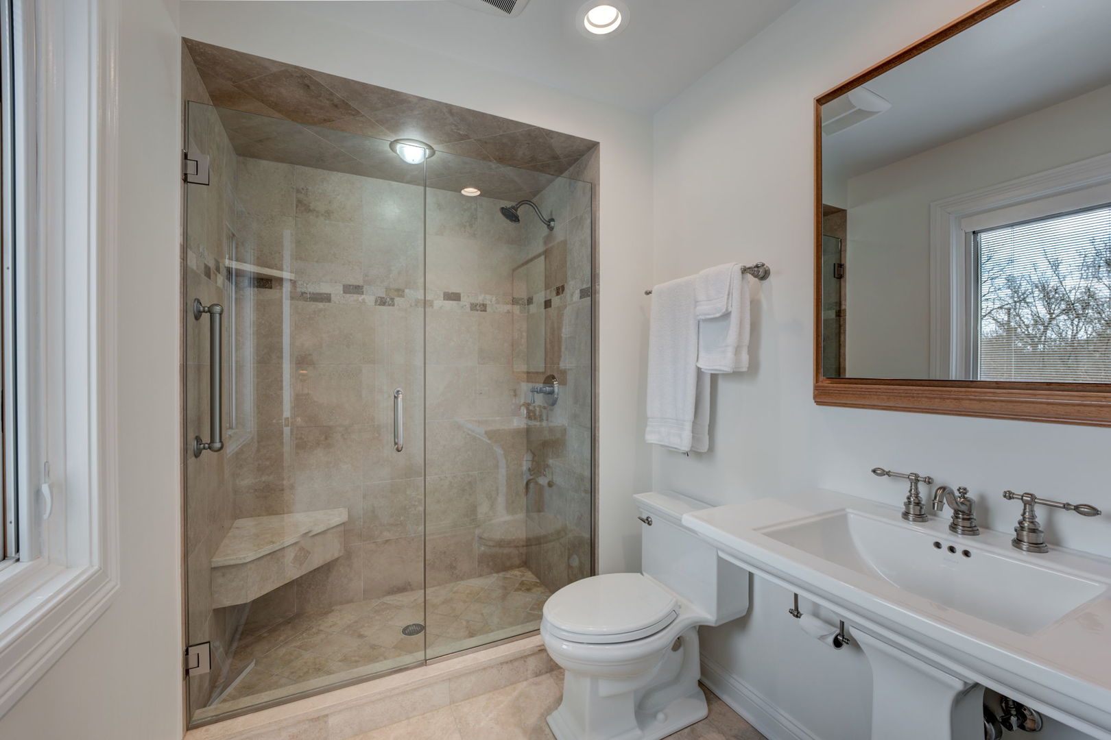 791 South Ridge Road Lake Forest, IL 60045 - Photo 26 of 40 a bathroom with a sink toilet a mirror and shower