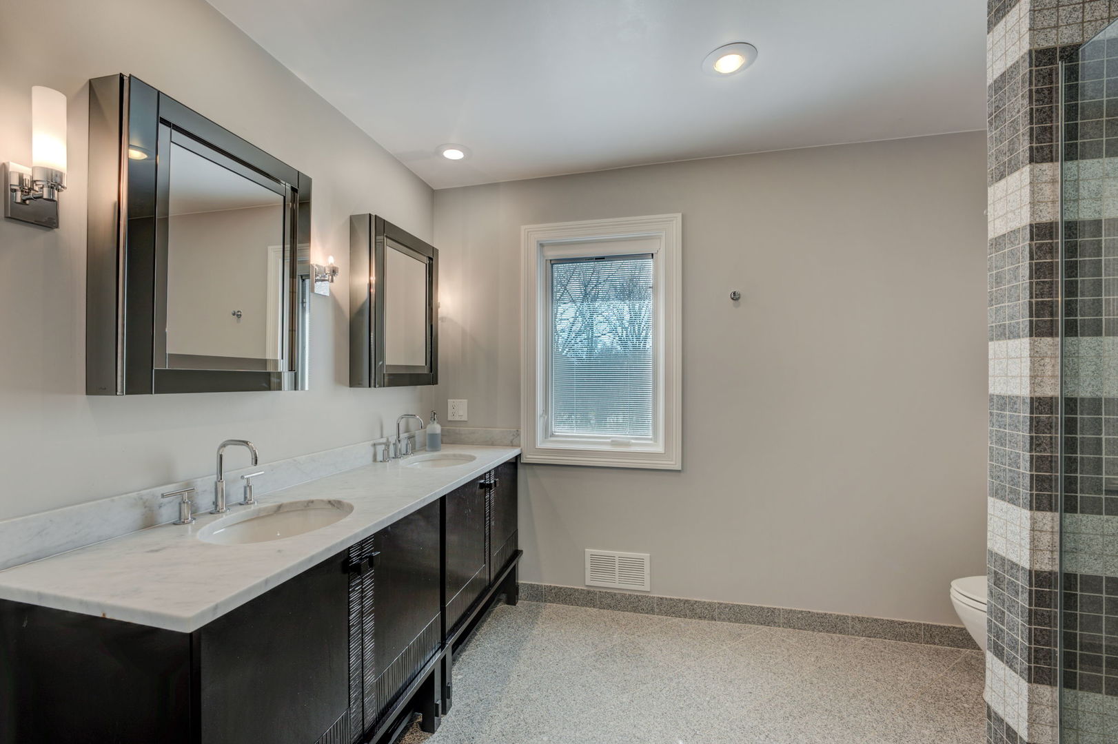 791 South Ridge Road Lake Forest, IL 60045 - Photo 29 of 40 a bathroom with double vanity sinks and a mirror