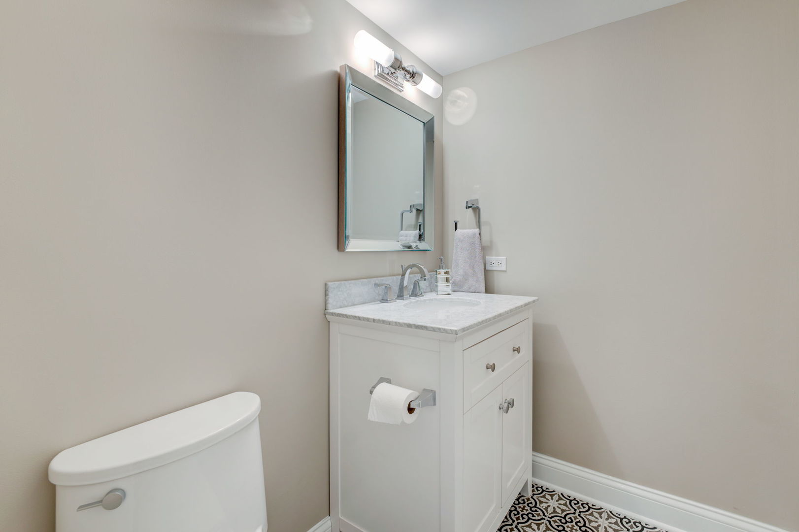 791 South Ridge Road Lake Forest, IL 60045 - Photo 33 of 40 a view of bathroom with a toilet sink and mirror