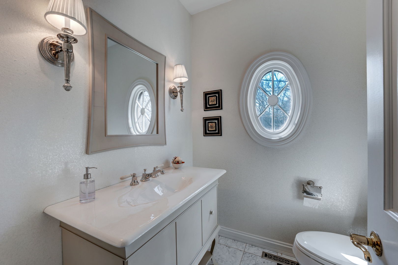 791 South Ridge Road Lake Forest, IL 60045 - Photo 9 of 40 a bathroom with a toilet a sink and a mirror