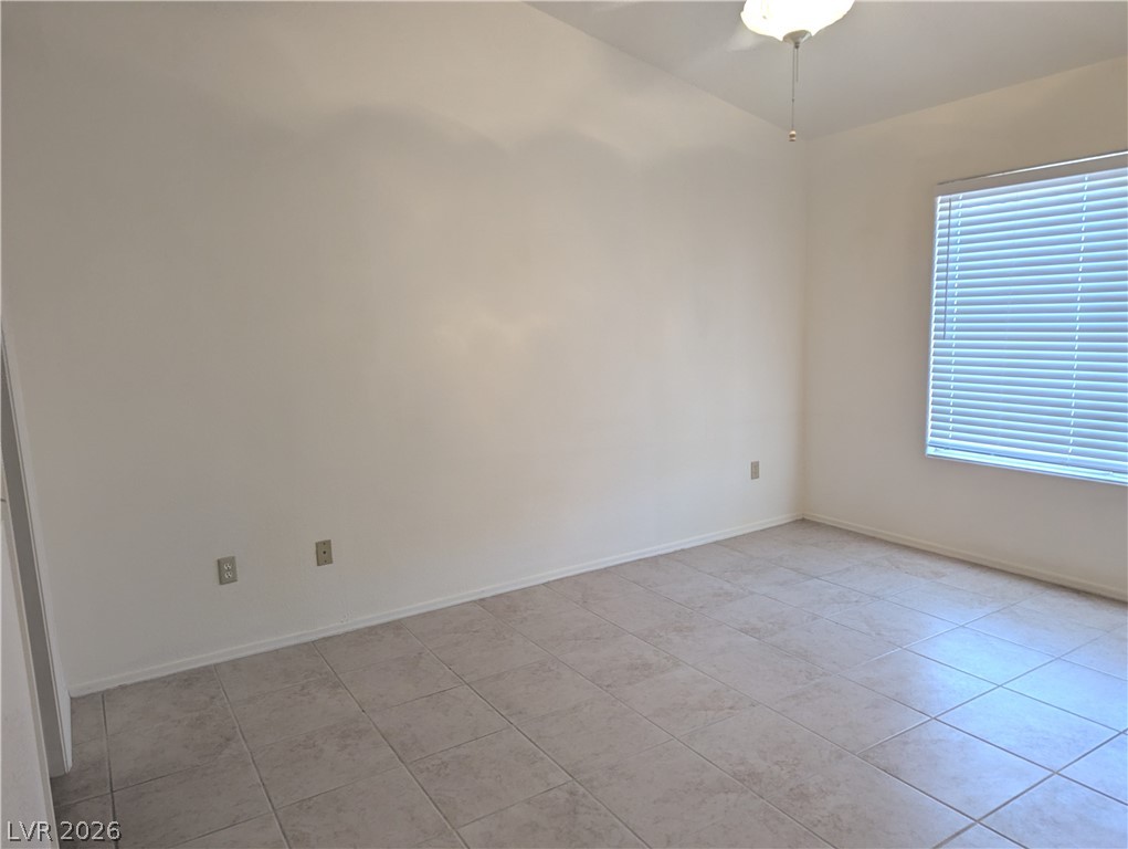 9433 Quail Ridge Drive Las Vegas, NV 89134 - Photo 9 of 23 A well-lit, open interior space featuring practical tiled flooring and abundant natural light.