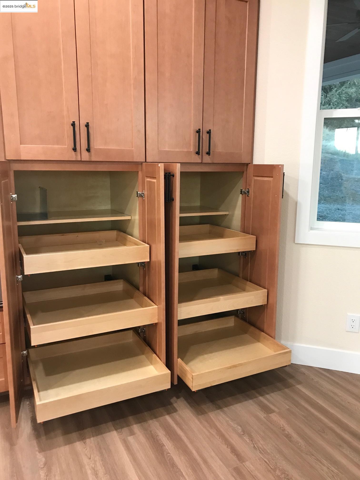 17500 Harvard Mine Road Jamestown, CA 95327 - Photo 10 of 28 Detailed view of light wood-style flooring and brown cabinetry