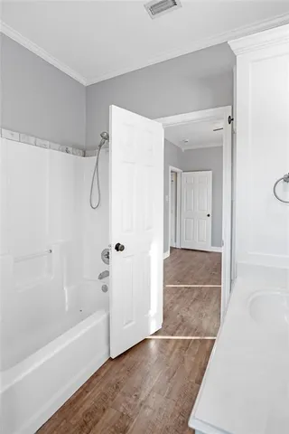 a bathroom with a bathtub and a shower