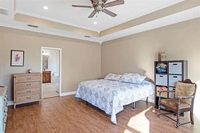 a bedroom with a bed and a dresser