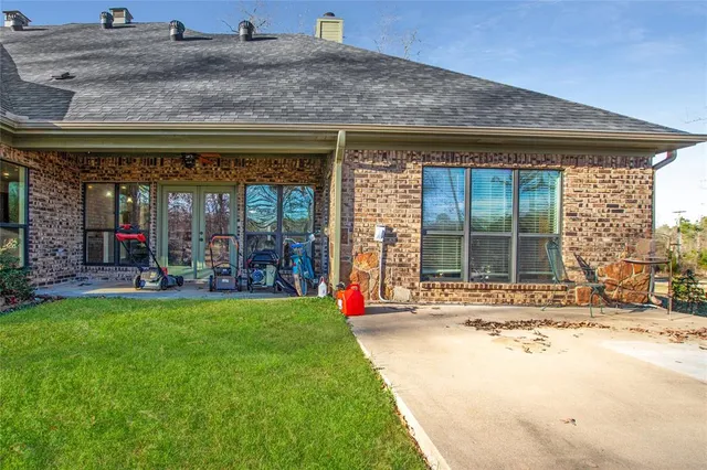 a view of a house with a backyard porch and sitting area