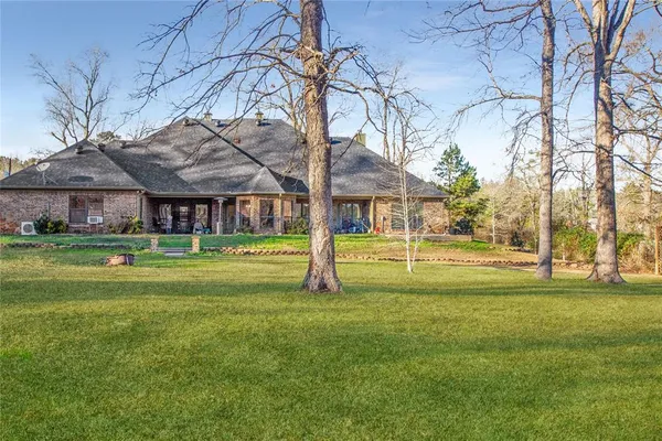 a view of a house with a big yard