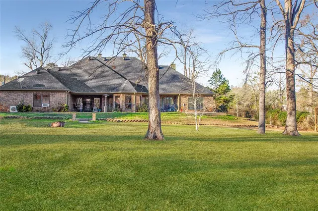 a view of a house with a big yard