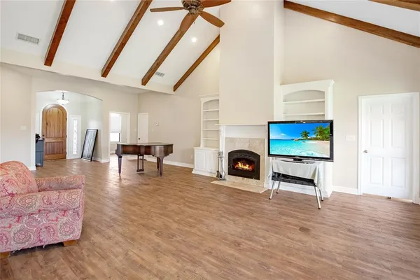a living room with furniture and a fireplace
