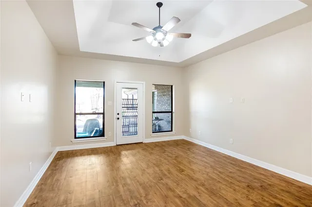 wooden floor in an empty room with a window