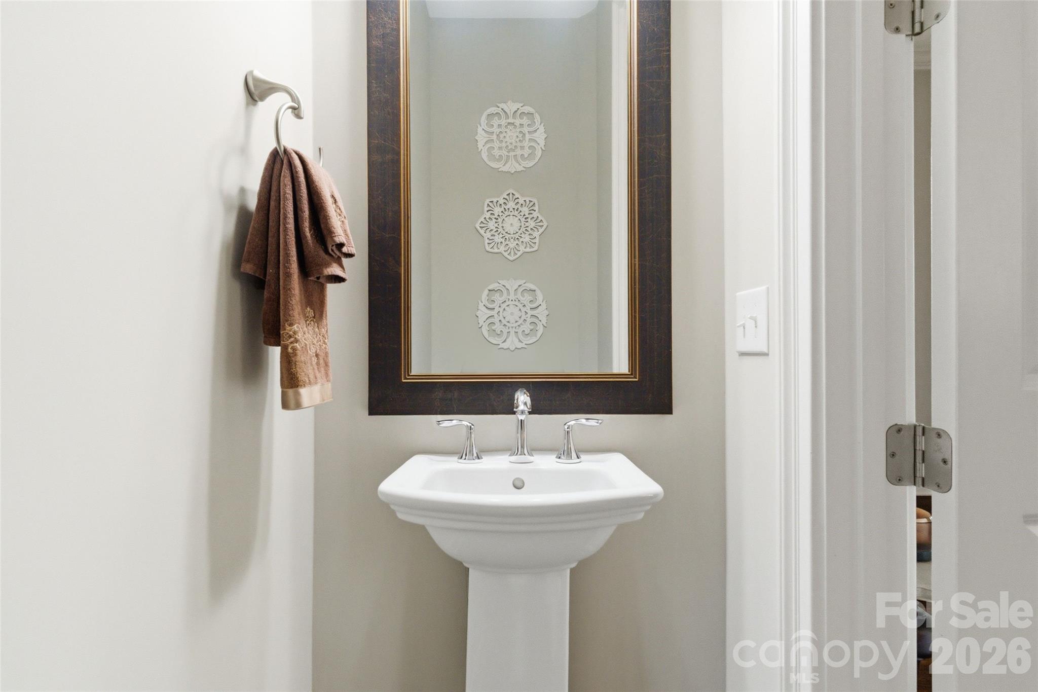 3097 Sherman Drive Lancaster, SC 29720 - Photo 19 of 48 a bathroom with a sink and a mirror