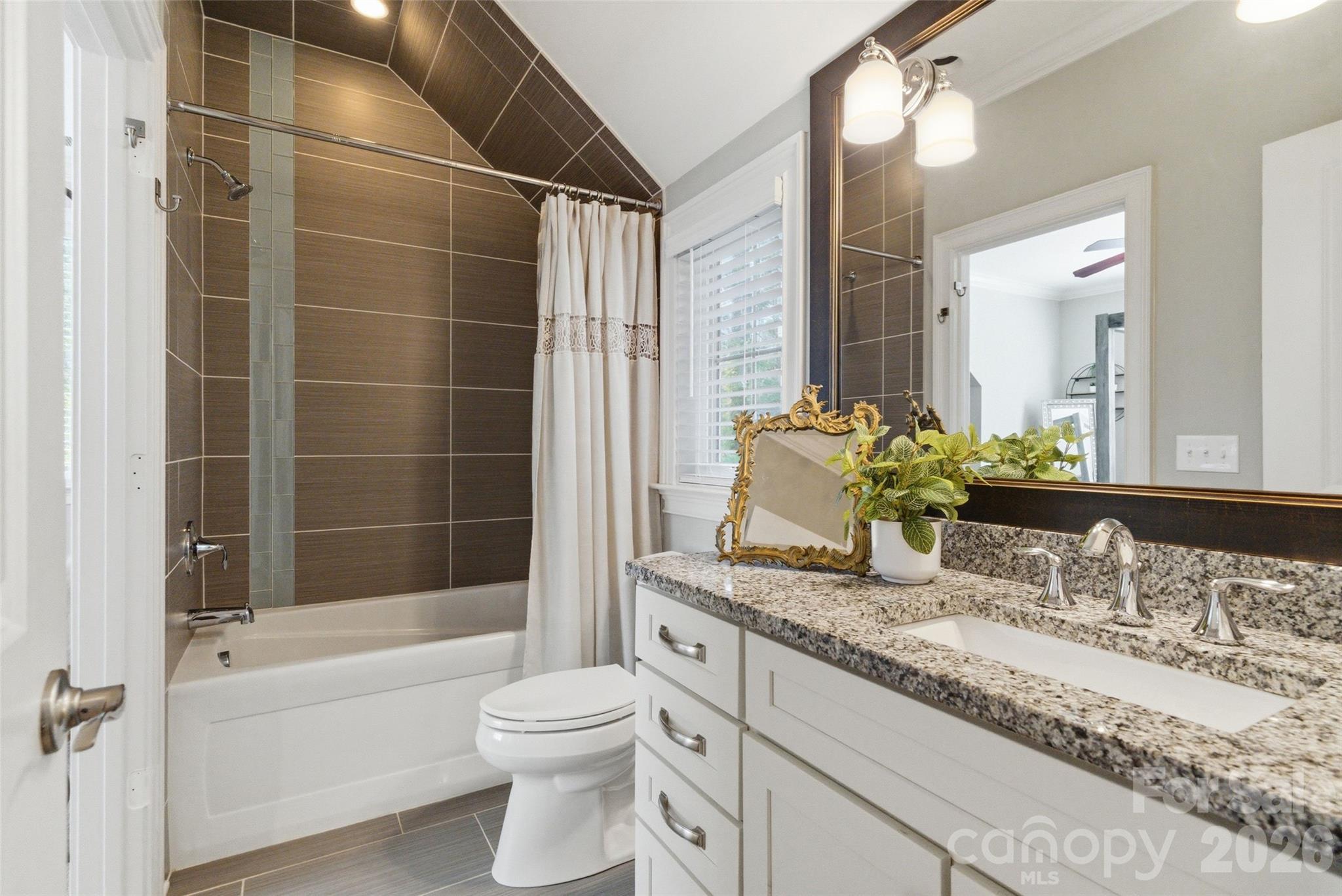 3097 Sherman Drive Lancaster, SC 29720 - Photo 31 of 48 a bathroom with a granite countertop sink and a mirror