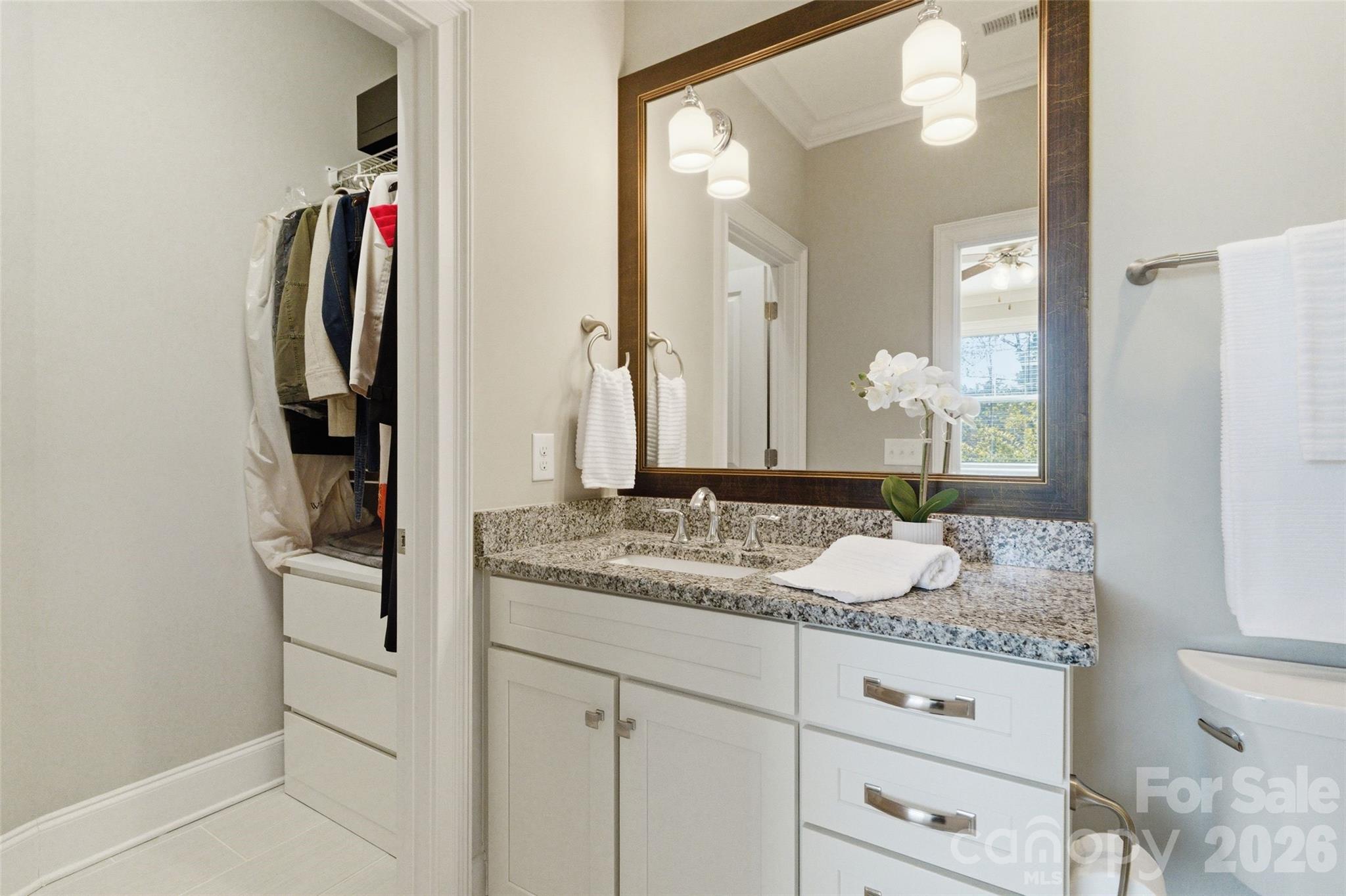 3097 Sherman Drive Lancaster, SC 29720 - Photo 36 of 48 a bathroom with a granite countertop sink and a mirror