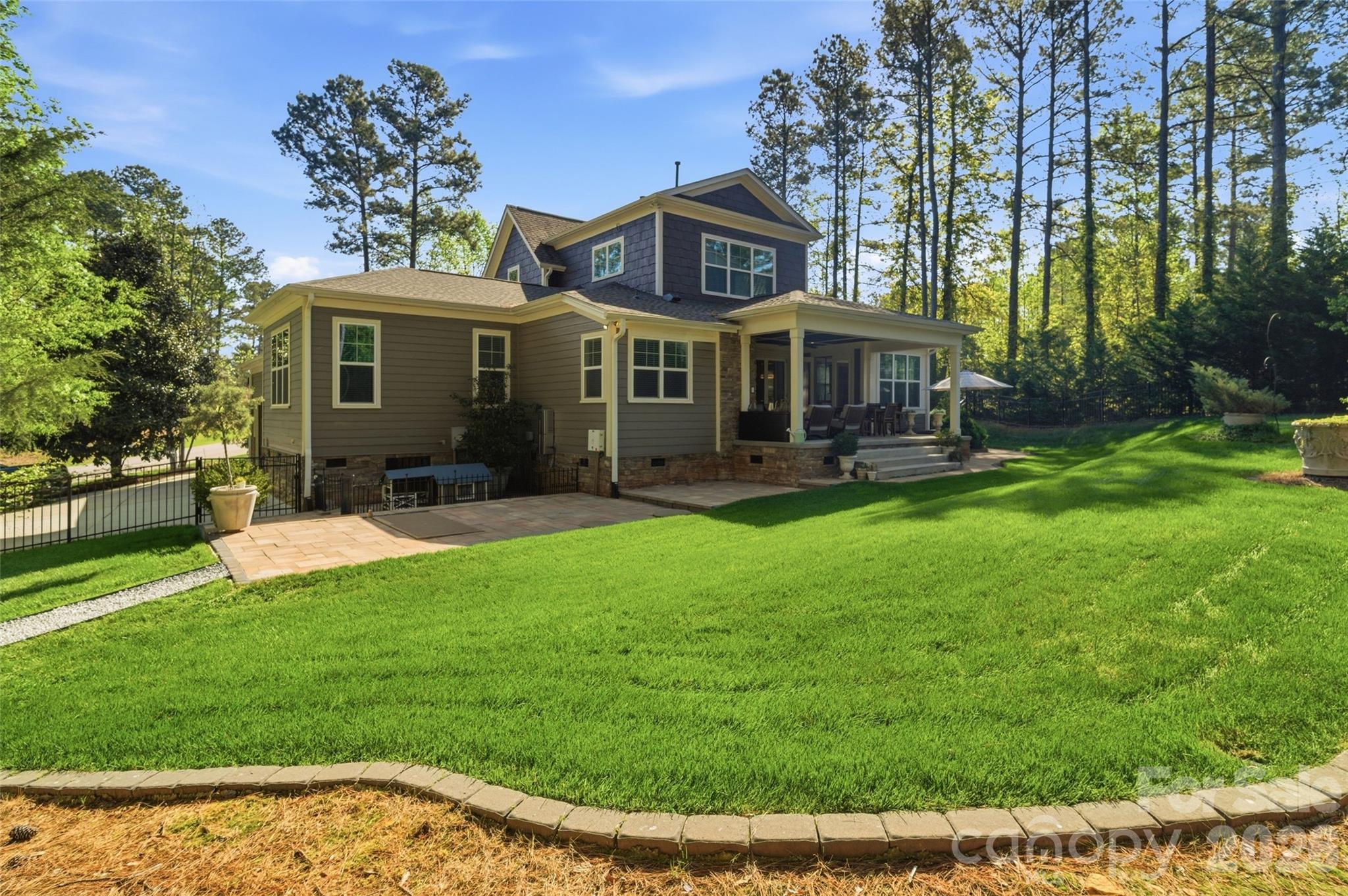 3097 Sherman Drive Lancaster, SC 29720 - Photo 45 of 48 a front view of a house with a yard table and chairs