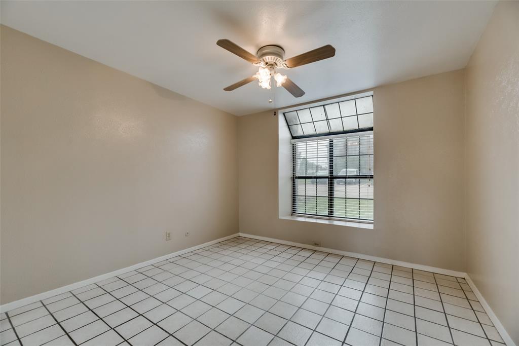 4544 Chaha Road, Unit 106 Garland, TX 75043 - Photo 13 of 17 Tiled empty room featuring ceiling fan