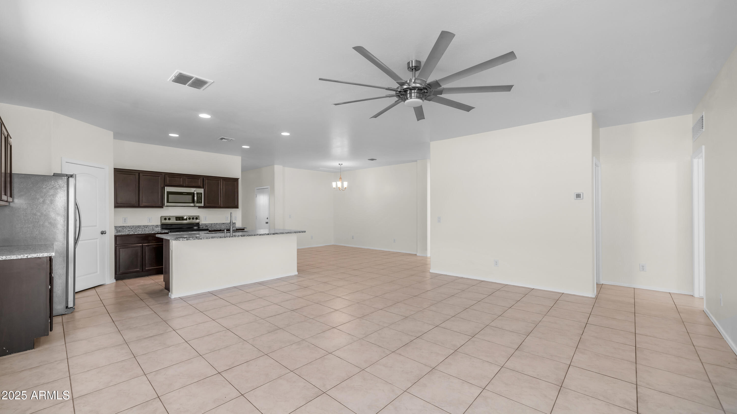 42017 West Rosa Drive Maricopa, AZ 85138 - Photo 5 of 13 a view of a kitchen with microwave and cabinets