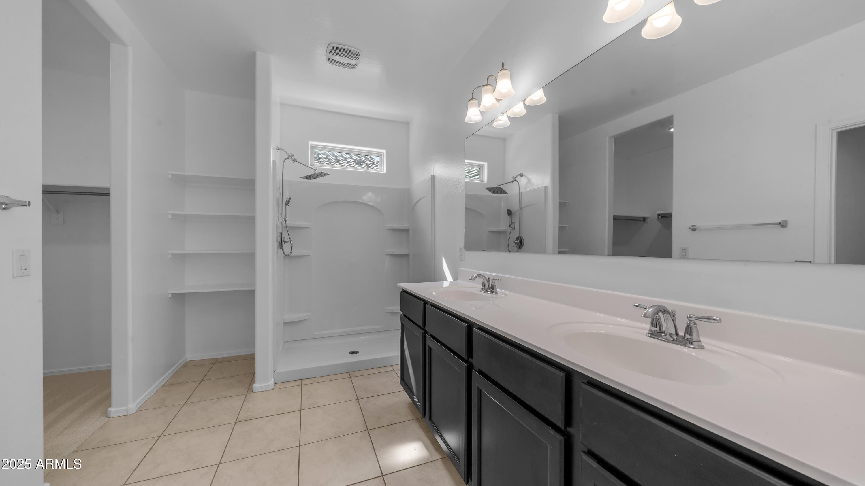 42017 West Rosa Drive Maricopa, AZ 85138 - Photo 7 of 13 a bathroom with a double vanity sink and a mirror