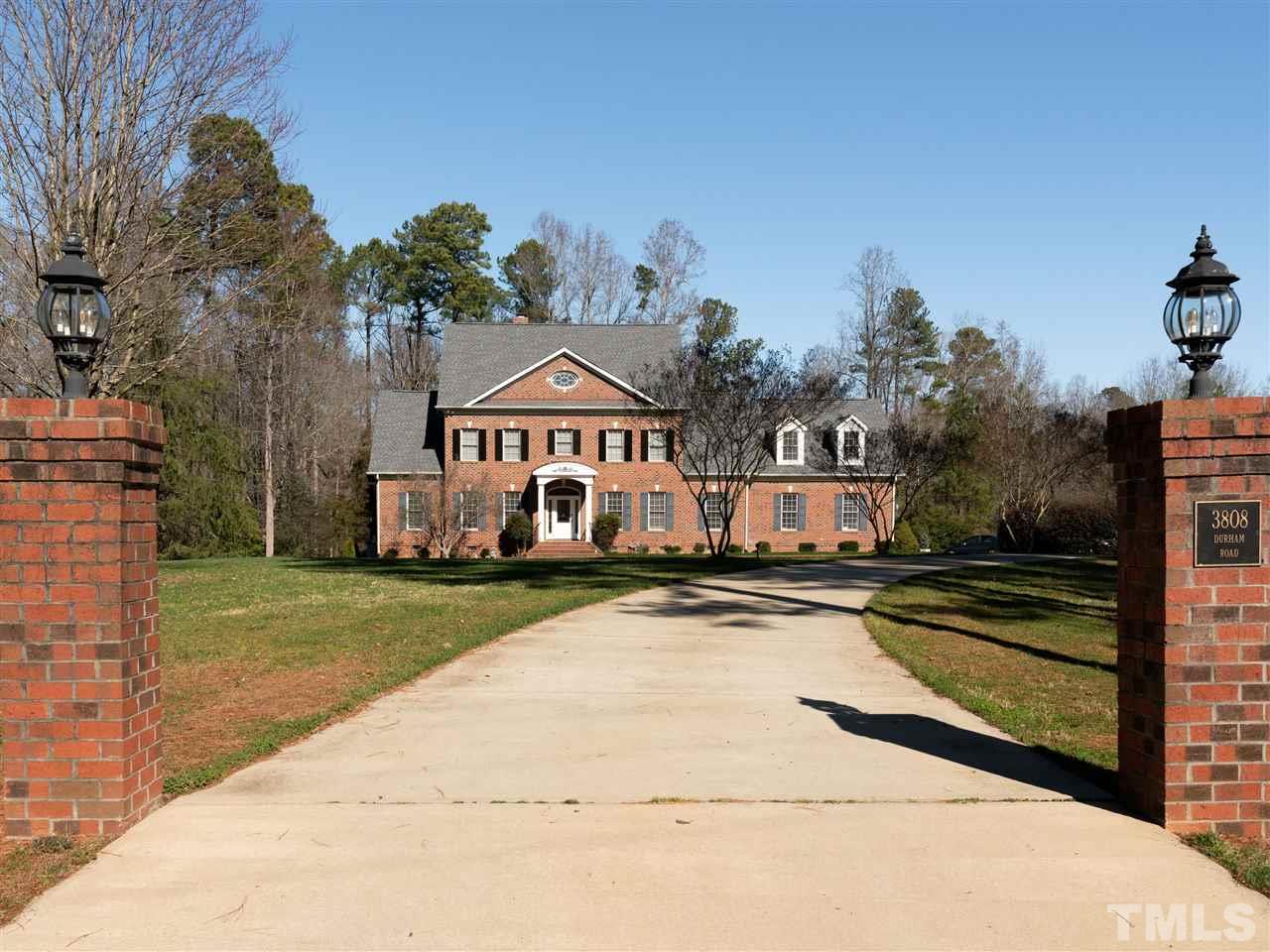 3820 Durham Road Raleigh, NC 27614 - Photo 10 of 11 a front view of a house with a yard