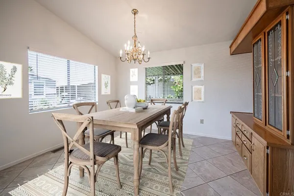 a room with chandelier and window
