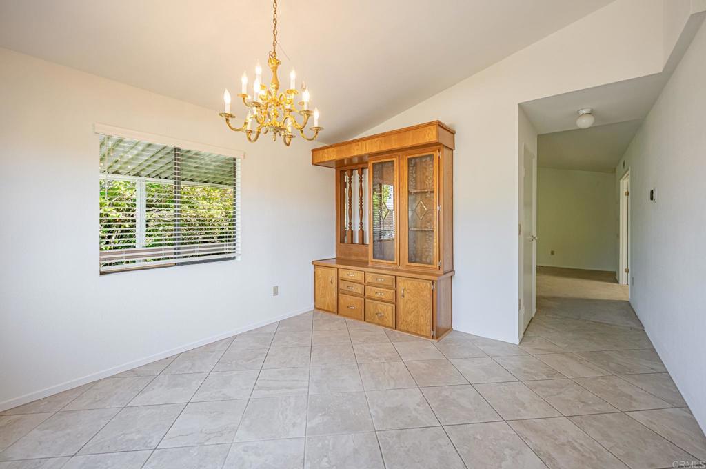 4650 Dulin Road, Unit 178 Fallbrook, CA 92003 - Photo 13 of 56 a room with chandelier and window