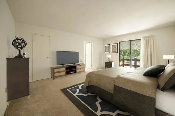 a view of an empty room and a window