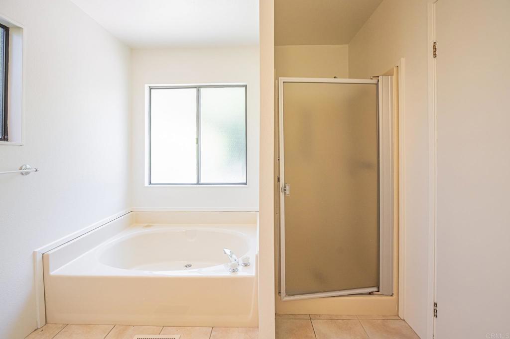 4650 Dulin Road, Unit 178 Fallbrook, CA 92003 - Photo 28 of 56 a bathroom with a bathtub and a shower