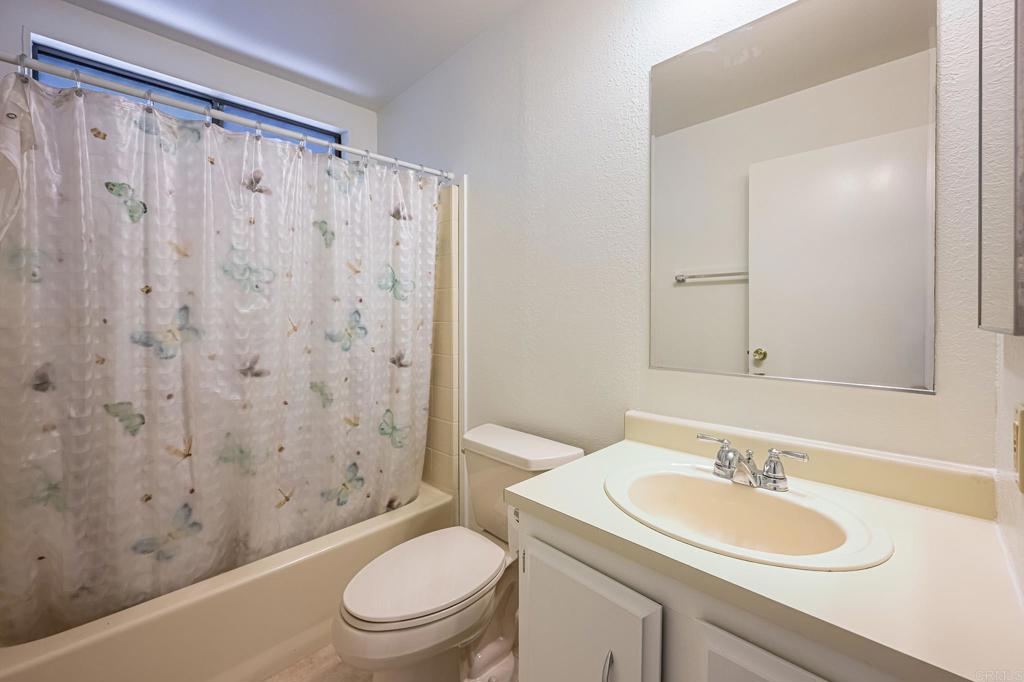 4650 Dulin Road, Unit 178 Fallbrook, CA 92003 - Photo 31 of 56 a bathroom with a sink a toilet and a mirror